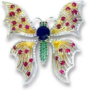 Broche papillon en pierres précieuses colorées