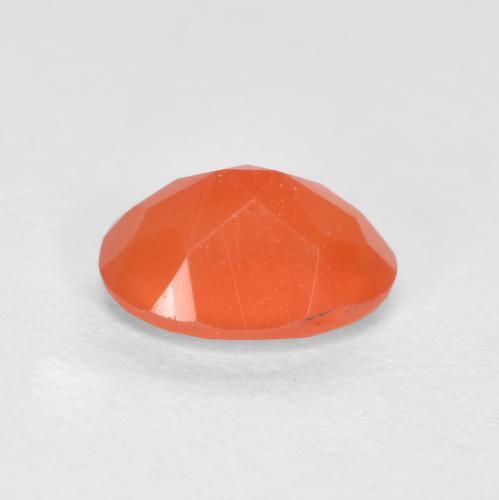 Cornaline orange feu naturelle coupe ovale, 0,69 ct, translucide