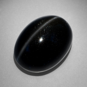 Scapolite œil de chat Noire naturelle Coupe ovale, 27.68 ct, Opaque