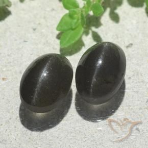 Shop natural 5.00ct Noire Scapolite œil de chat gems, ovale, from Madagascar at GemSelect. In stock, global shipping!