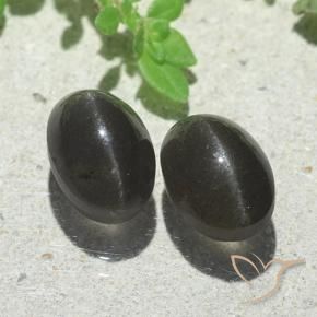 Shop natural 5.00ct Noire Scapolite œil de chat gems, ovale, from Madagascar at GemSelect. In stock, global shipping!