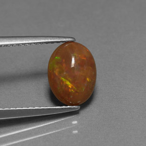 Opale chocolat multicolore naturelle coupe ovale, 0,83 ct, opaque