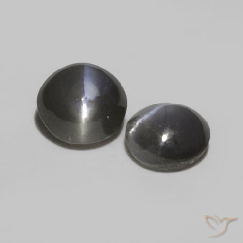Shop natural 0.52ct Noir grisâtre Oeil de Chat Chrysobéryl gems, ovale, from Sri Lanka at GemSelect. In stock, global shipping!