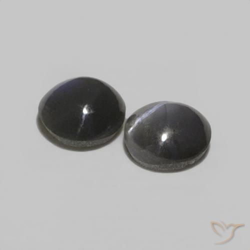 Shop natural 0.52ct Noir grisâtre Oeil de Chat Chrysobéryl gems, ovale, from Sri Lanka at GemSelect. In stock, global shipping!