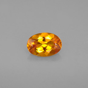 Clinohumite orange naturelle coupe ovale, 0,67 ct, VS