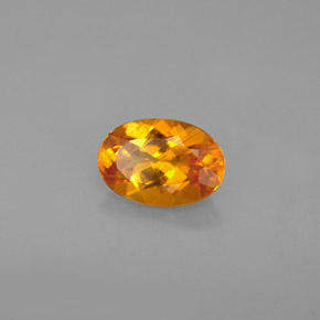 Clinohumite orange naturelle coupe ovale, 0,67 ct, VS