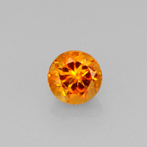 Clinohumite orange naturelle coupe roude, 0,64 ct, VS