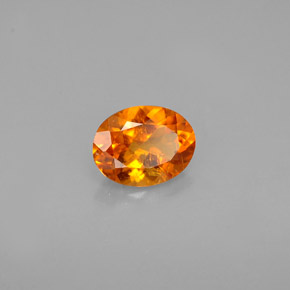 Clinohumite Jaune orange naturelle Coupe ovale, 0.60 ct, VS-SI