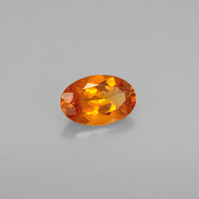 Clinohumite Jaune orange naturelle Coupe ovale, 0.54 ct, VS-SI