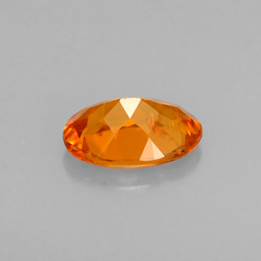 Clinohumite orange naturelle coupe ovale, 0,58 ct, VS