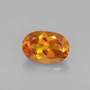 Clinohumite Jaune orange naturelle Coupe ovale, 0.60 ct, VS-SI