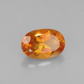 Clinohumite Jaune orange naturelle Coupe ovale, 0.60 ct, VS-SI