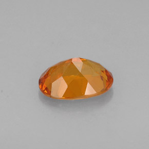Clinohumite Jaune orange naturelle Coupe ovale, 0.60 ct, VS-SI