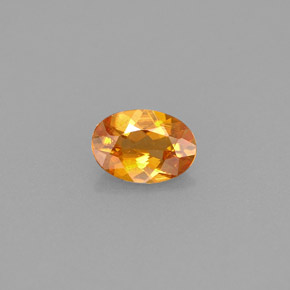 Clinohumite orange naturelle coupe ovale, 0,42 ct, VS