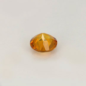 Clinohumite orange jaunâtre naturelle coupe roude, 0,52 ct, VS