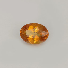 Clinohumite Jaune orange naturelle Coupe ovale, 0.77 ct, VS