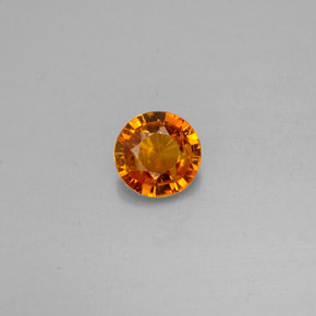 Clinohumite Jaune orange naturelle Coupe roude, 0.63 ct, VS-SI