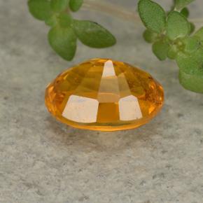 Clinohumite orange naturelle coupe ovale, 0,84 ct, VS-SI
