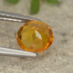 Clinohumite Jaune orange naturelle Coupe roude, 0.87 ct, VS-SI