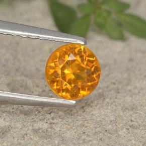 Clinohumite Jaune orange naturelle Coupe roude, 0.63 ct, VS-SI