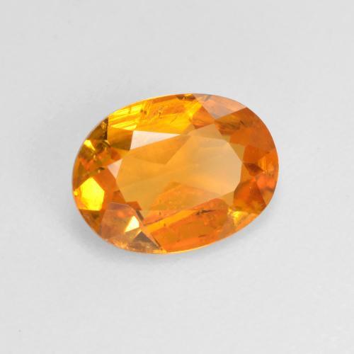 Clinohumite Abricot orange naturelle Coupe ovale, 0.99 ct, VS-SI