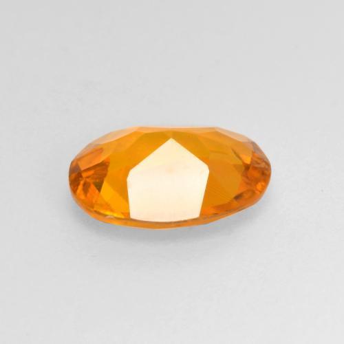 Clinohumite Abricot orange naturelle Coupe ovale, 0.99 ct, VS-SI