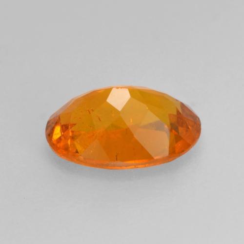 Clinohumite orange naturelle coupe ovale, 0,82 ct, SI