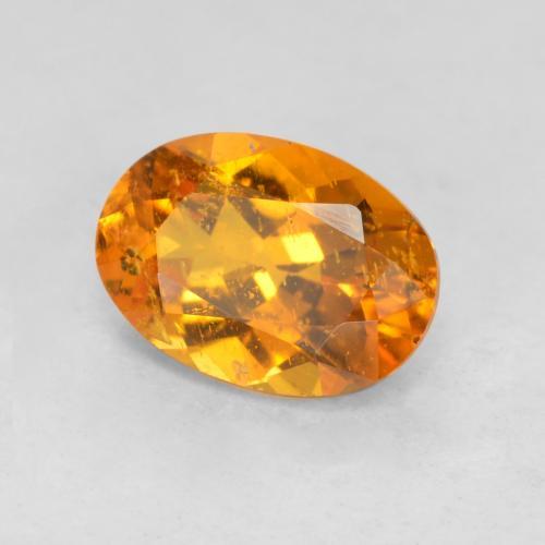Clinohumite orange naturelle coupe ovale, 0,85 ct, SI-I1