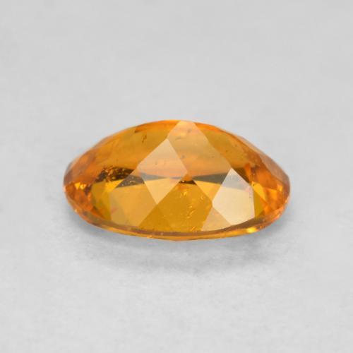 Clinohumite orange naturelle coupe ovale, 0,85 ct, SI-I1