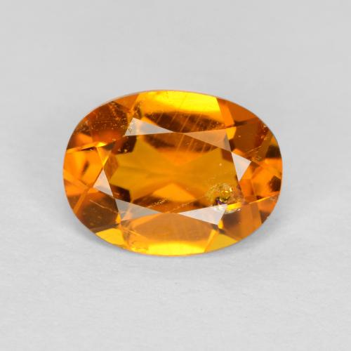 Clinohumite Orange foncé naturelle Coupe ovale, 0.89 ct, SI