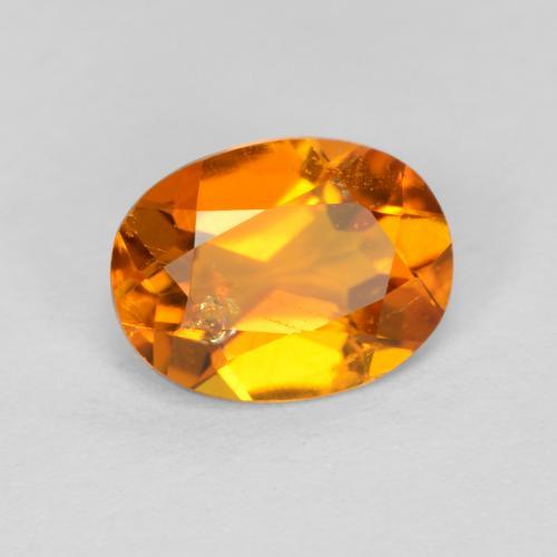 Clinohumite Orange foncé naturelle Coupe ovale, 0.89 ct, SI