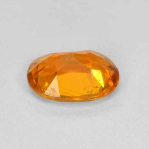 Clinohumite Orange foncé naturelle Coupe ovale, 0.89 ct, SI