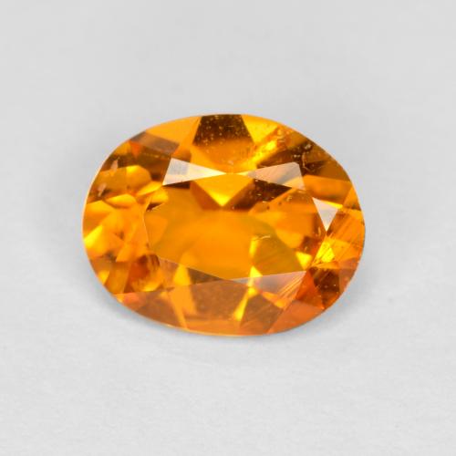 Clinohumite orange naturelle coupe ovale, 0,68 ct, SI