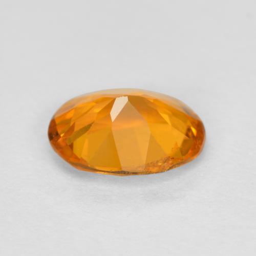 Clinohumite orange naturelle coupe ovale, 0,68 ct, SI