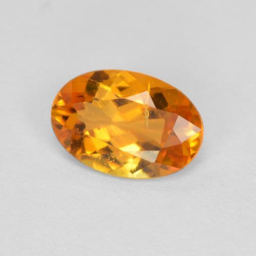 Clinohumite Abricot orange naturelle Coupe ovale, 0.43 ct, SI