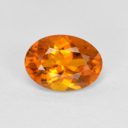 Clinohumite Orange moyen naturelle Coupe ovale, 0.74 ct, SI