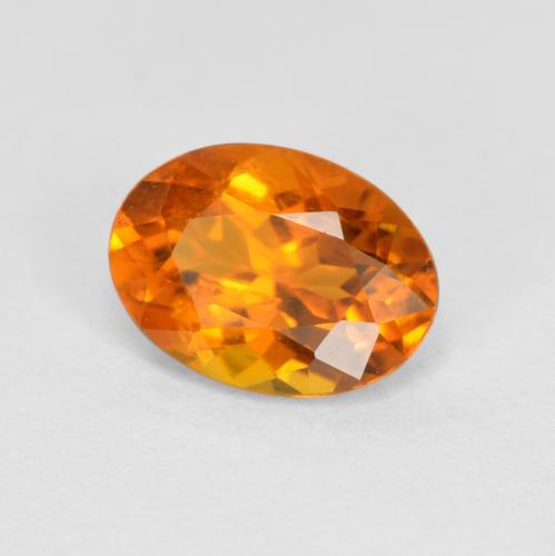 Clinohumite Orange moyen naturelle Coupe ovale, 0.74 ct, SI