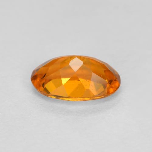 Clinohumite Orange foncé naturelle Coupe ovale, 0.41 ct, VS-SI