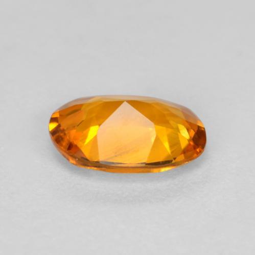 Clinohumite orange naturelle coupe ovale, 0,41 ct, VS
