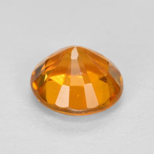 Clinohumite orange naturelle coupe roude, 0,48 ct, VS