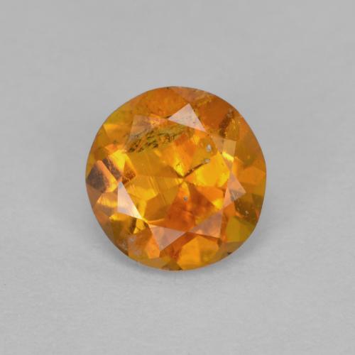 Clinohumite orange moyen naturelle coupe roude, 0,63 ct, SI