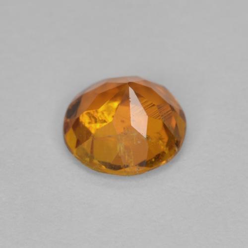Clinohumite orange moyen naturelle coupe roude, 0,63 ct, SI
