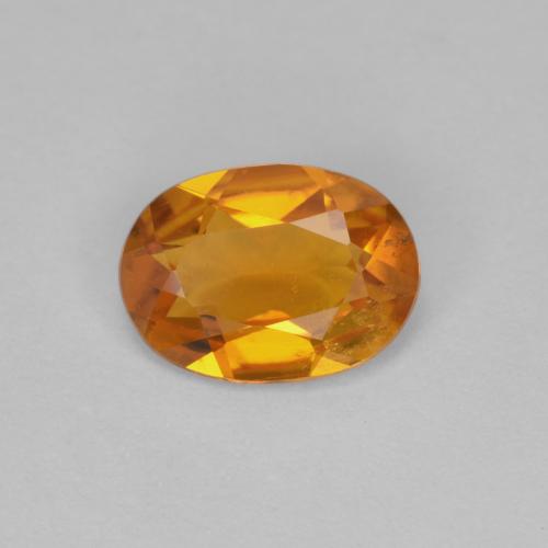 Clinohumite orange naturelle coupe ovale, 0,90 ct, VS-SI