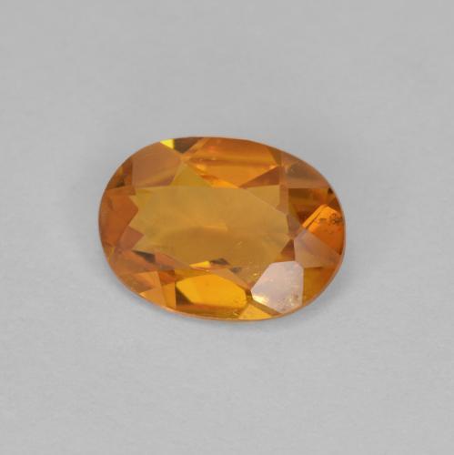 Clinohumite orange naturelle coupe ovale, 0,90 ct, VS-SI