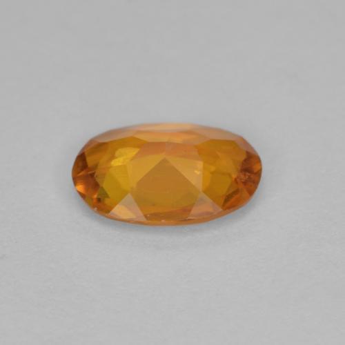 Clinohumite orange naturelle coupe ovale, 0,90 ct, VS-SI