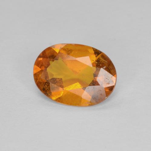 Clinohumite orange naturelle coupe ovale, 0,94 ct, SI