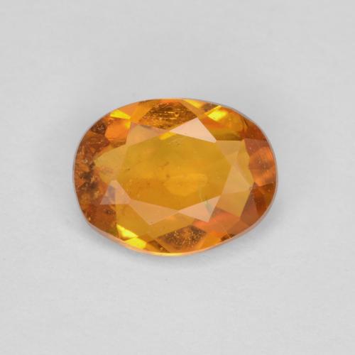 Clinohumite Orange brun naturelle Coupe ovale, 0.65 ct, SI