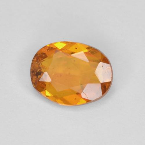 Clinohumite Orange brun naturelle Coupe ovale, 0.65 ct, SI