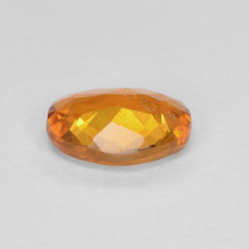 Clinohumite Orange brun naturelle Coupe ovale, 0.65 ct, SI