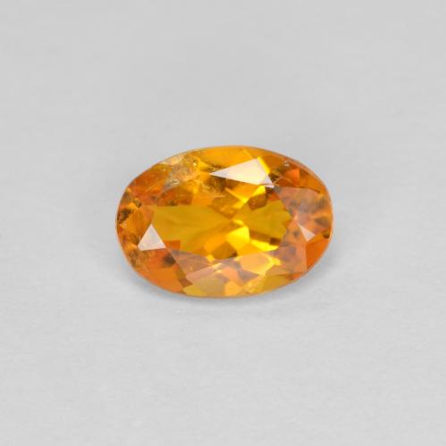 Clinohumite Abricot orange naturelle Coupe ovale, 0.60 ct, SI